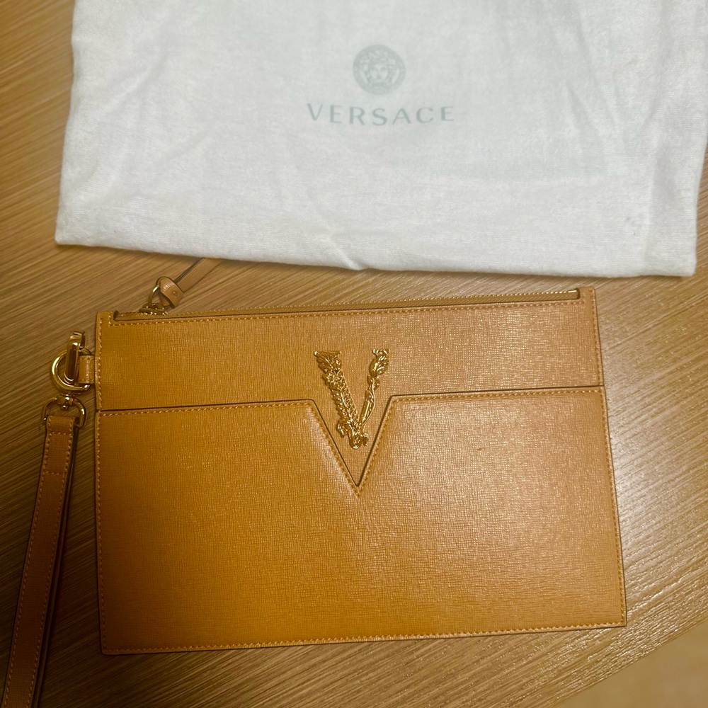 Versace clutch bag like new . Only wore it once